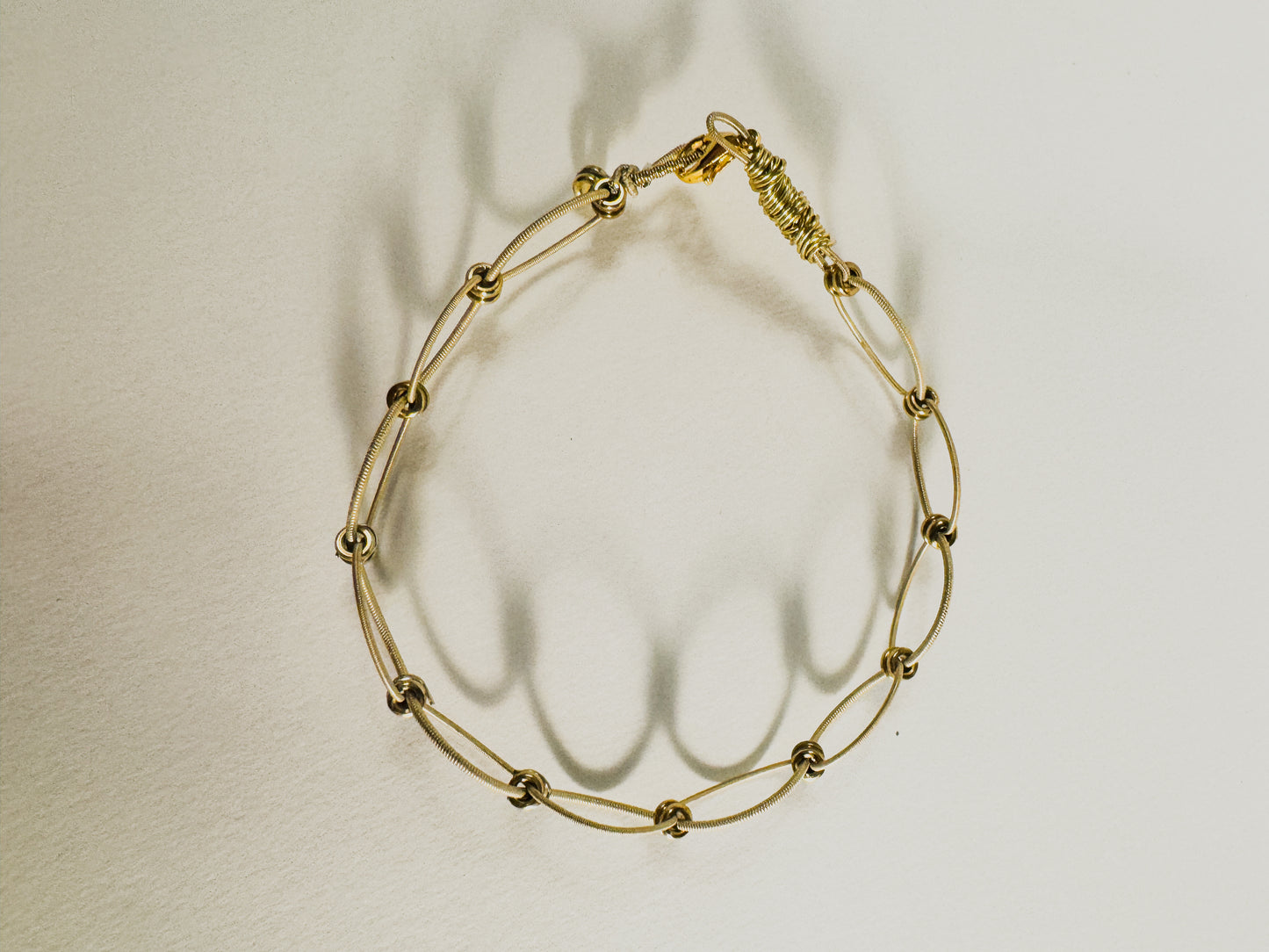 gold little loop guitar string bracelet